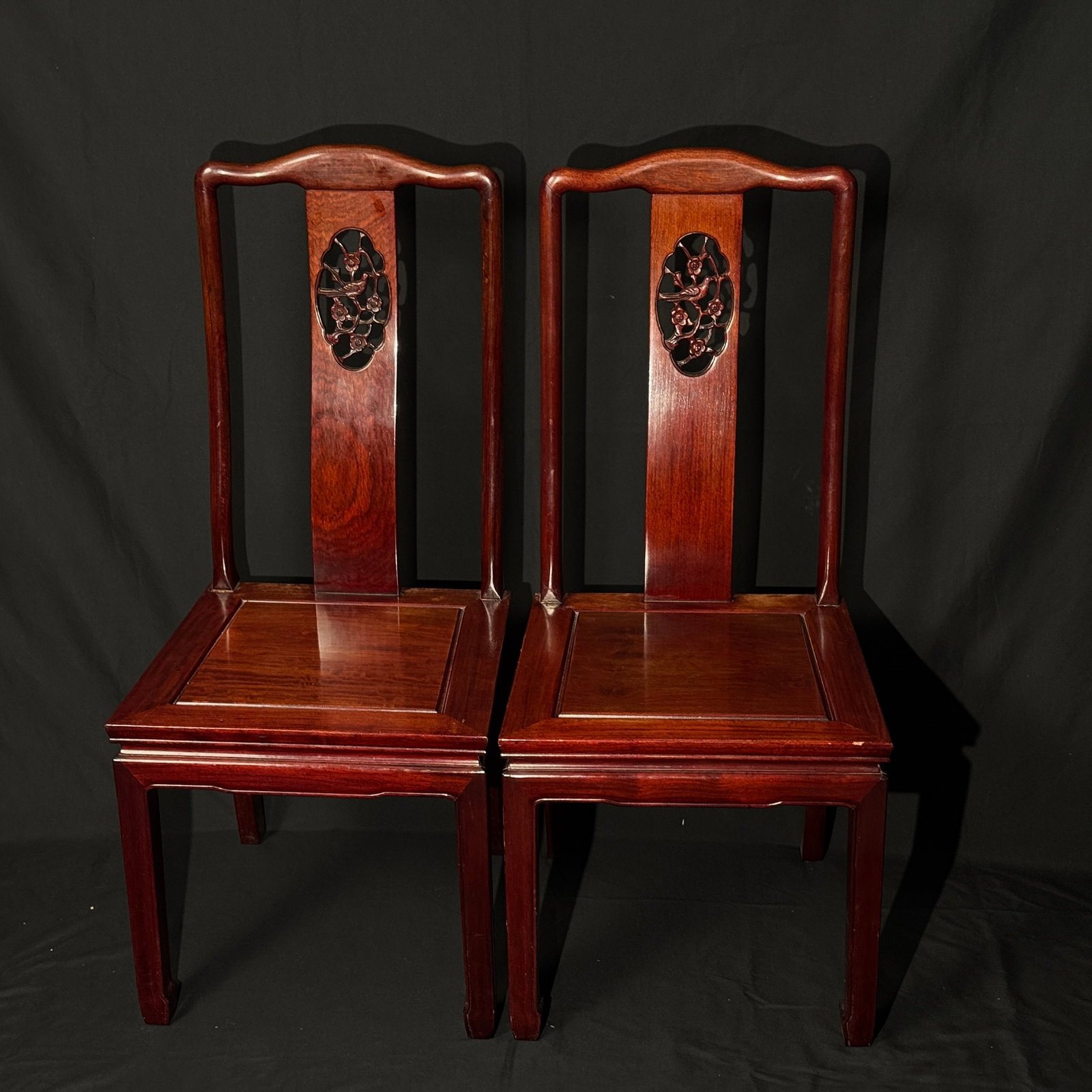 Pair of Late Qing–Republican Rosewood Pierced-Carved Scholar's Chairs, 'Xi Shang Meishao' Motif: A matched pair, with mortise and tenon joints securely constructed. The original lacquer shows natural wear, with minor nicks to the edges and corners, no breaks or losses. Some areas with old