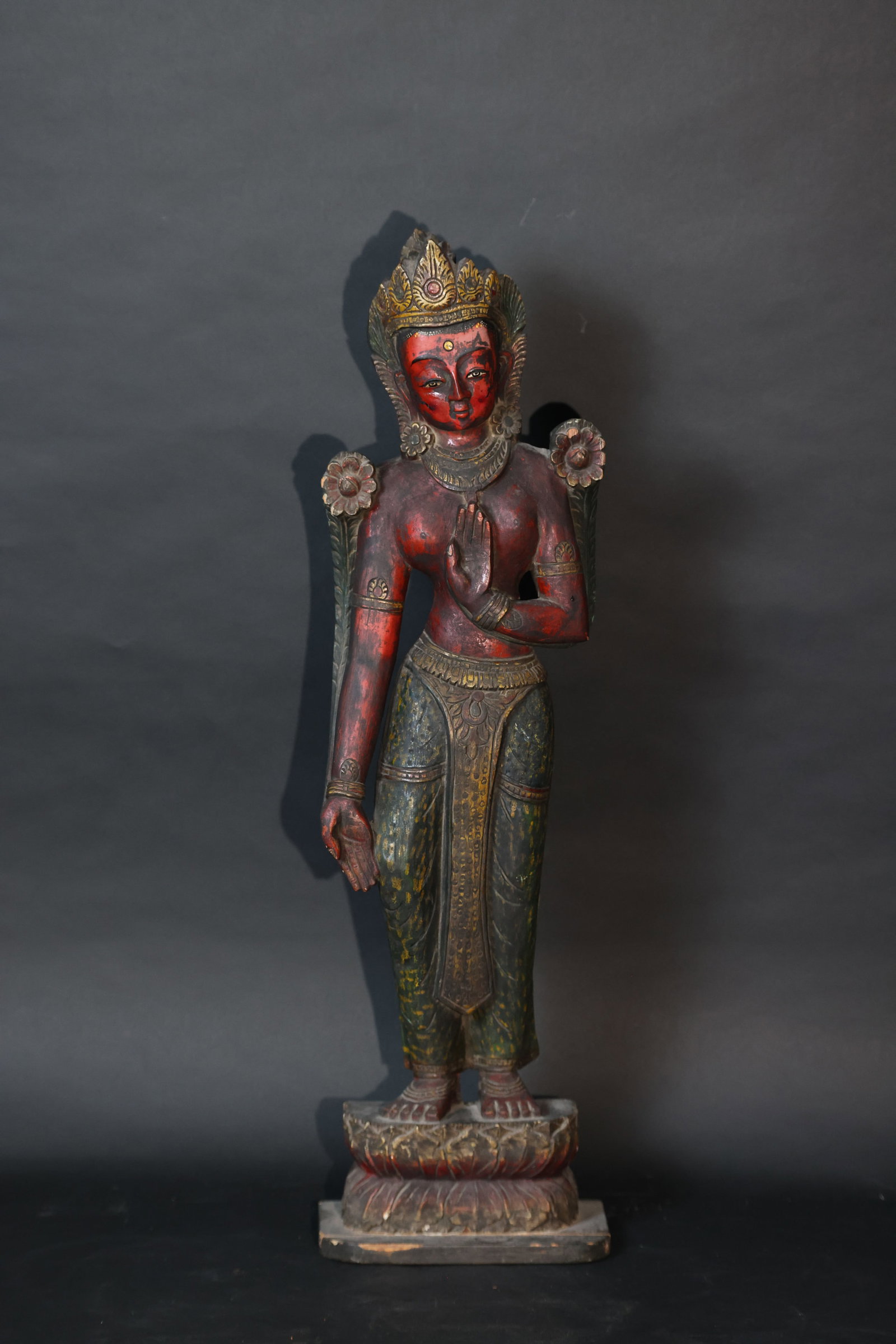 Nepalese Polychrome Painted Wood Standing White Tara Statue: Overall structurally intact with no breaks or missing parts. The lacquer shows extensive natural aging, craquelure, and areas of wear and loss. Old restoration traces are visible on the reverse. Minor