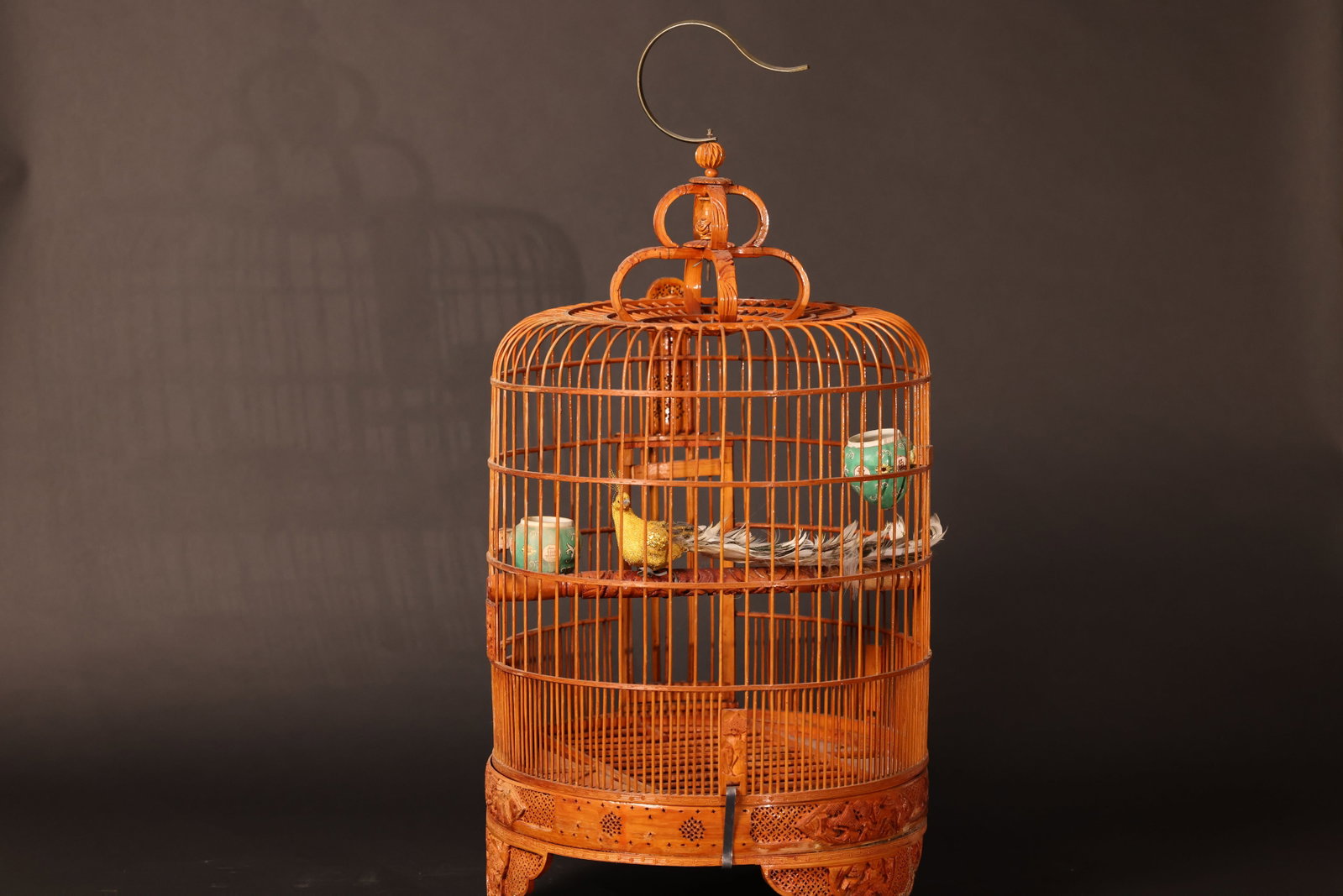Large Carved Bamboo Birdcage: Overall structure is complete and sturdy, with a smooth, well-patinated bamboo surface. Minor wear consistent with normal use; a few fine bamboo strands with slight nicks, but no significant losses. H