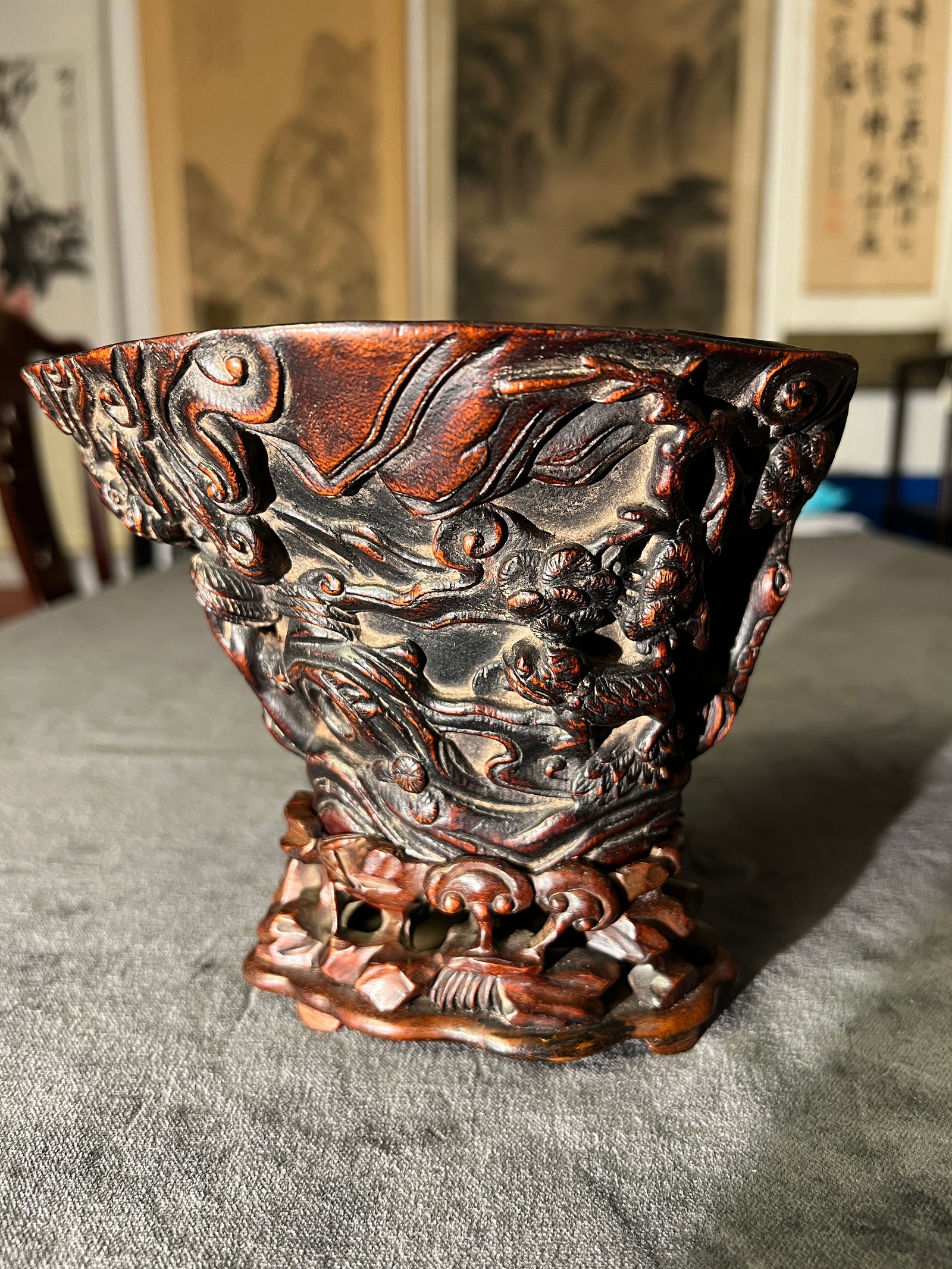 Mid-Qing agarwood cup carved with scholar and cloud-and-dragon motif: In excellent condition with natural age-related patina. H 14.5cm W 17cm