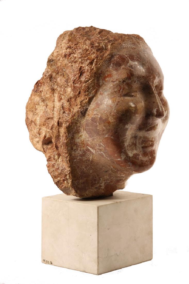 MARBLE SCULPTURE: 'Laughing Head, 1975' by Sahl Swarz (NJ, 1912 - ? ), a bust portrait in red marble, set on a travertine plinth, 16 3/4" tall, 7 1/2" x 10 1/2". Fine condition.