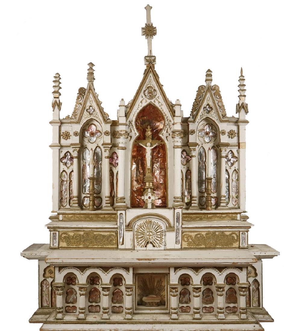 FOLK ART ALTAR: Large Homemade and Home-Use Gothic Style Altar in white and gold painted wood, with foil wrapping paper inserts inside the molded panels, crucifix in the center apse, faux candles in the flanking alco