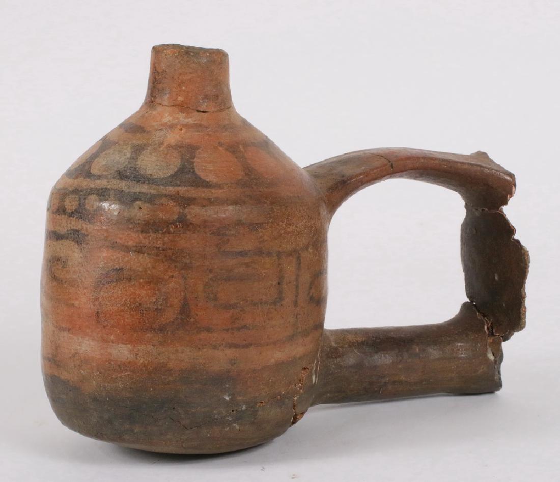 PRE-COLUMBIAN POTTERY: Fragment of a Pre-Columbian Inca Peru Double Chamber Wedding Vessel, reassembled, retaining the original decoration, roughly 6" x 7" x 4". Condition as found.