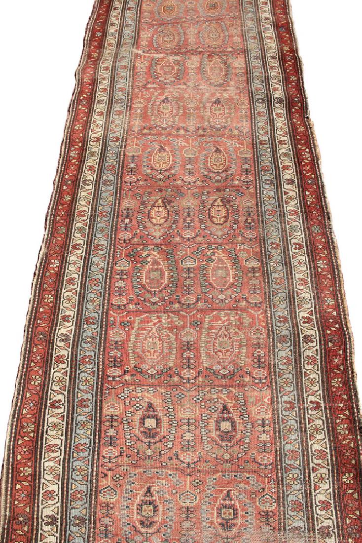 HAMADAN RUNNER: 3'4" x 15'3" - Northwest Persia, early 20th c., rows of boteh on a rust-red field, multiple rosette meandering borders. Fair condition, areas of wear, loss to each end, selvage damage. From the Sewall