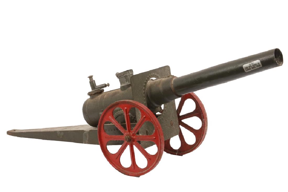 VINTAGE TOY CANNON: WWI Era Conestoga "Big Bang" Carbide Cannon model 10FC, major field artillery, with shield, cast iron and tin, in the original olive green and red paint, 17" long barrel, 24 1/2" long overall. Light c