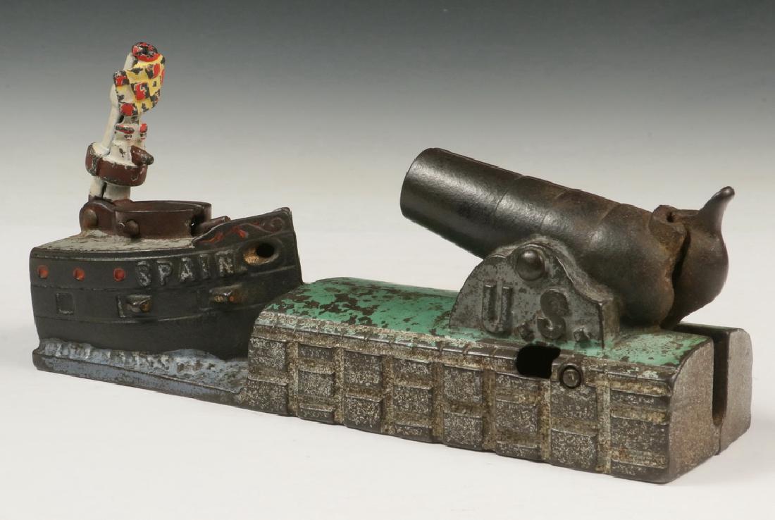 PATRIOTIC MECHANICAL PENNY BANK: Spanish-American War Era Painted Iron Bank by J&E Stevens, Cromwell, CT, patented 1898, featuring a cannon marked 'U.S.' that shoots a penny to knock over the castle on a Naval Dreadnought marked 'Spa