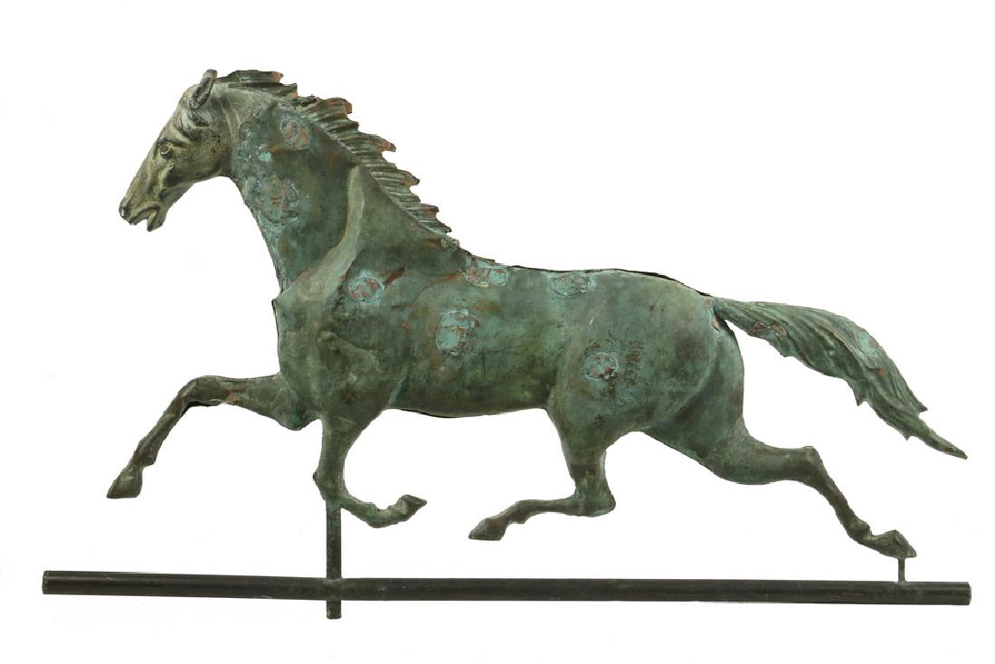ANTIQUE HORSE WEATHERVANE: American, late 19th c., full body copper, cast zinc head, on copper tube frame, attributed to J.W. Fiske Co., N.Y. "Pachen" model. 17" x 30" overall. Dents, repaired bullet holes, verdigris patina.