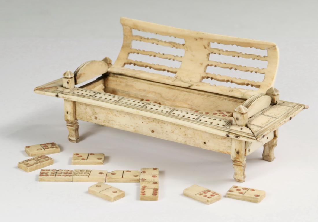 18TH C. SAILOR-MADE WHALE BONE DOMINOES CAGE: Italian Renaissance form Storage Box with domed and arched hinged top, four pyramidal finials at top of legs that penetrate a flange surround, drilled for score keeping with (missing) pegs. (33) handm