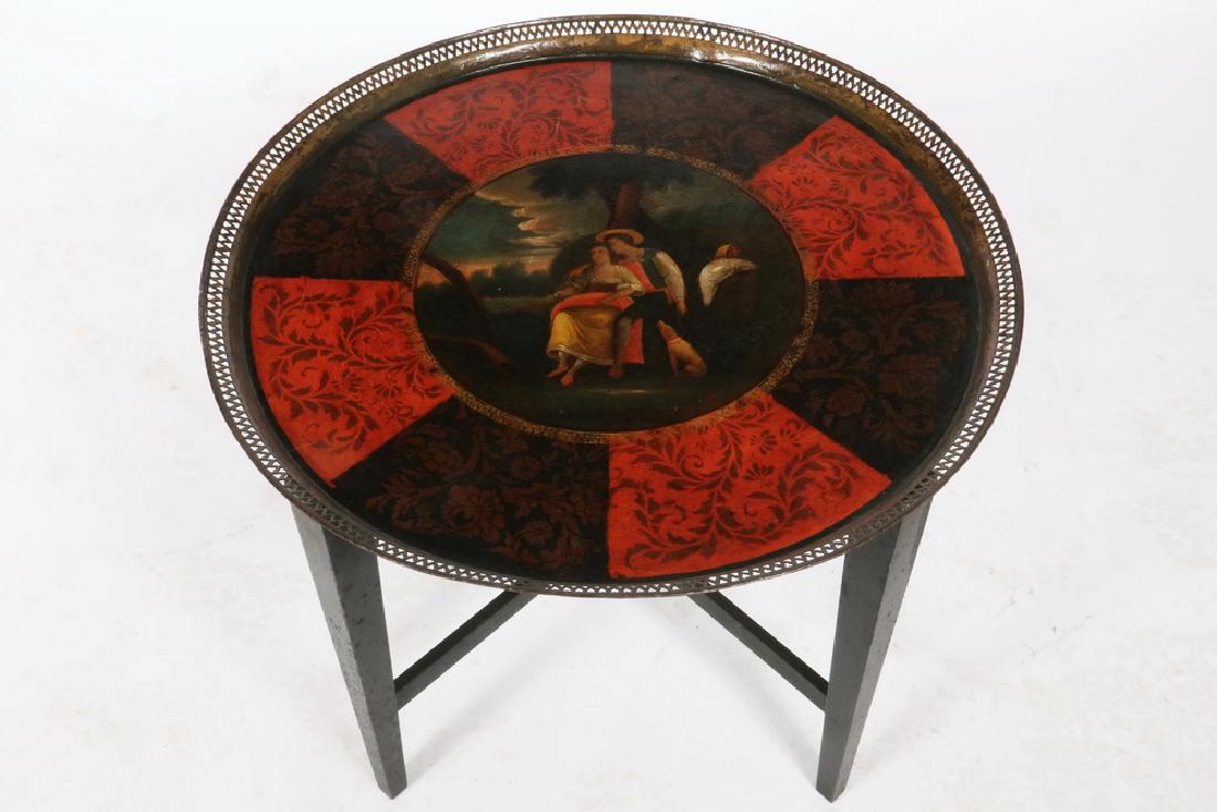 TOLE TRAY ON STAND: Early 19th c. English Round Steel Tray with reticulated gallery, having a wonderful pastoral courting scene painted at the center, surrounded by alternating red and black panels, with an overlay of st