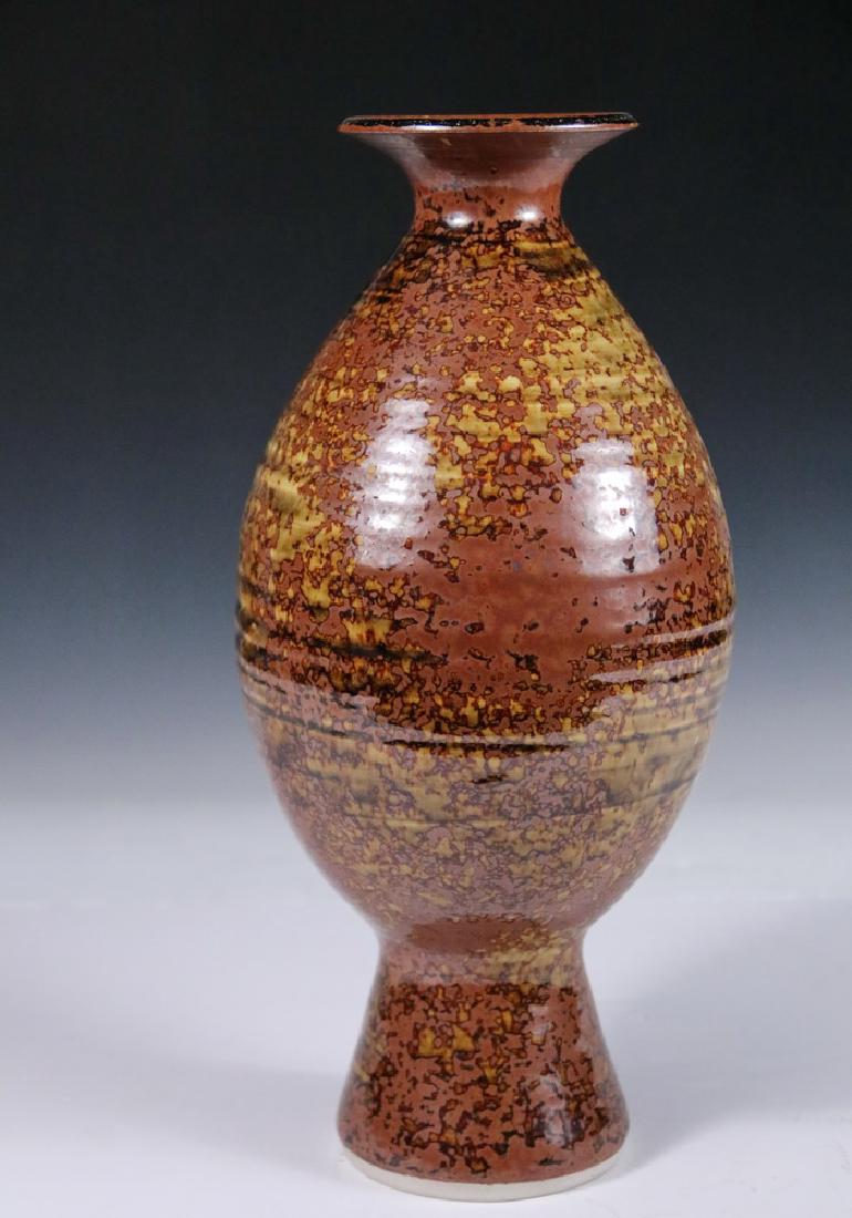 THOMAS BEZANSON (VT, 1929-2007): Footed Ovoid Art Pottery Vase with Ribbed Sides and Flared Rim, with dark celadon and iron yellow glaze, incised on base rim "Benedictine Monks, Weston, Vermont" and in marker "URBON", 12 3/4" tall, 6