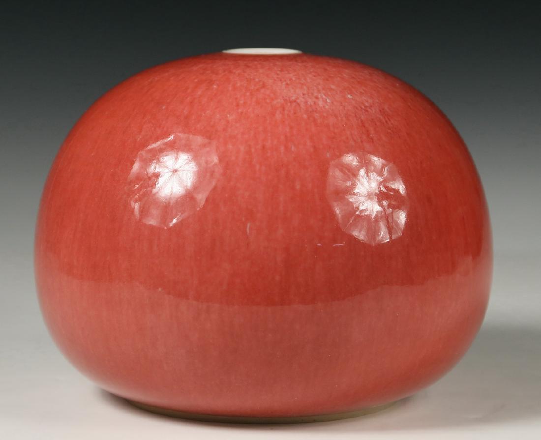 THOMAS BEZANSON (VT, 1929-2007): Porcelain Vase with copper red glaze, orb shape with flat opening, incised on base 'Benedictine Monks, Weston, Vermont' and with Brother Thomas' 1970s mark, impressed 'A400', in ink '2/1' and '30/3/12
