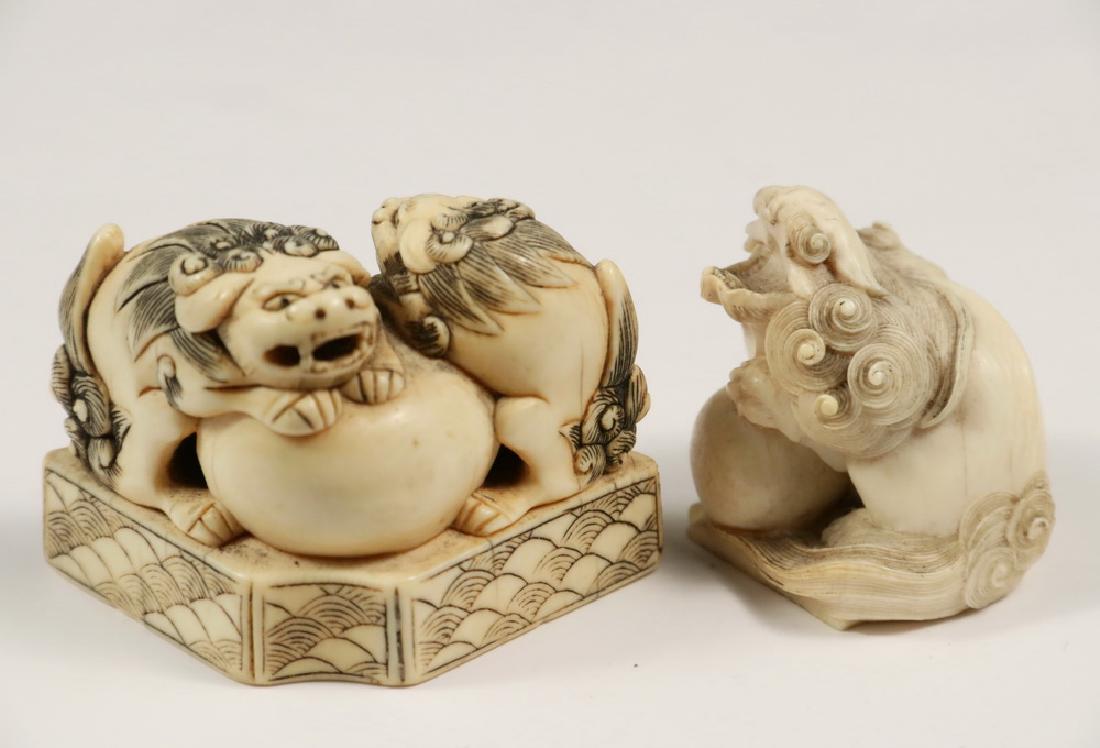 (2) JAPANESE OJIME: Both 19th c., including: A Pair of Foo Dogs guarding a giant pearl atop a fan shaped platform, remnant of signature on the underside, 1 1/2" x 2 1/4" x 1 1/4", good condition; PLUS A Finely Carved Sin
