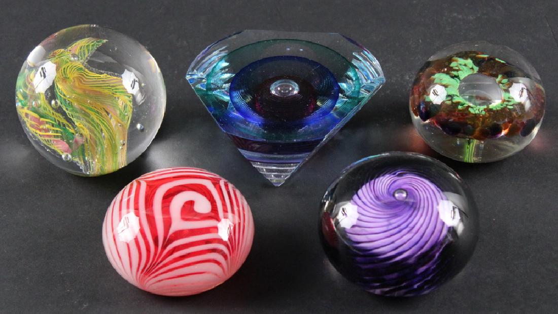 (5) ART GLASS PAPERWEIGHTS: Group of (5) Art Glass Paperweights, including: Triangular form, signed on base Michael David & Kit Karbler, #58993, 1 7/8" high, 4 1/2" wide; Purple swirl around central bubble, signed 'Frost '01', 2