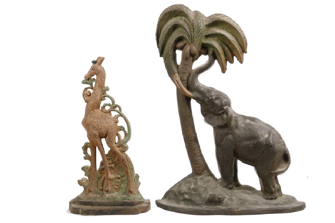 (2) CAST IRON DOORSTOPS: (2) Cast Iron Figural Doorstops depicting Animals, including: Elephant and Palm Tree, by National Foundry, New York, early 20th c., with original surface, 13 3/4" high, 10 1/4" wide, paint losses; and