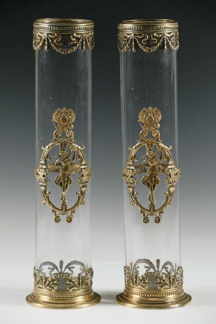 PAIR OF SILVER MOUNTED VASES: Pair of Russian Gilded 88-Silver Mounted Glass Cylindrical Vases, ca. 1900, with Cyrillic mark of Grachev Brothers, assay mark of Aleksandr Vasilyevich Romanov, silver mounts include the image of a da