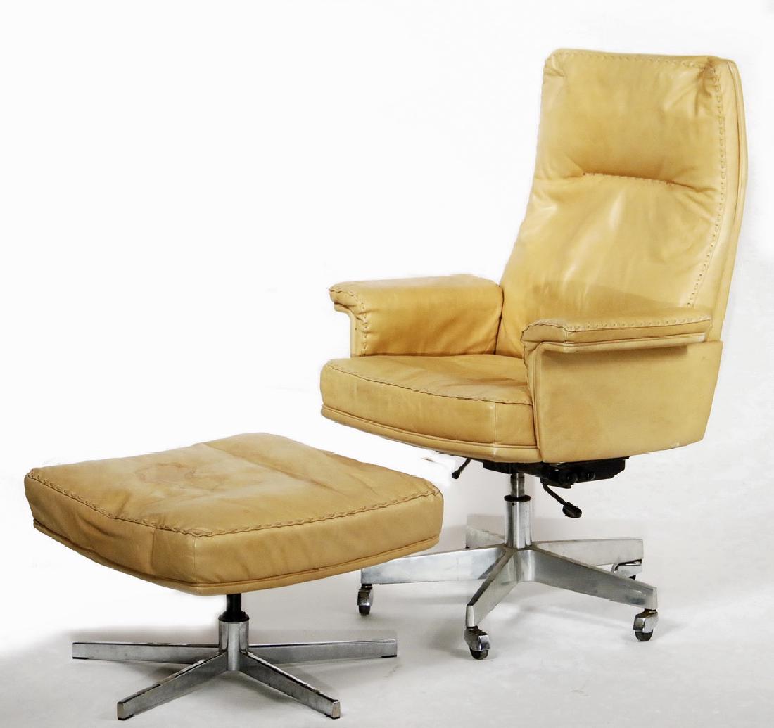 SWISS DESIGNER LEATHER OFFICE CHAIR WITH HASSOCK: Vintage DS 31 Office Chair from 1965 by De Sede Design Team for De Sede, Switzerland, in the original cognac leather with exposed lacing, adjustable height, on five stem chromed base, on casters, 22"