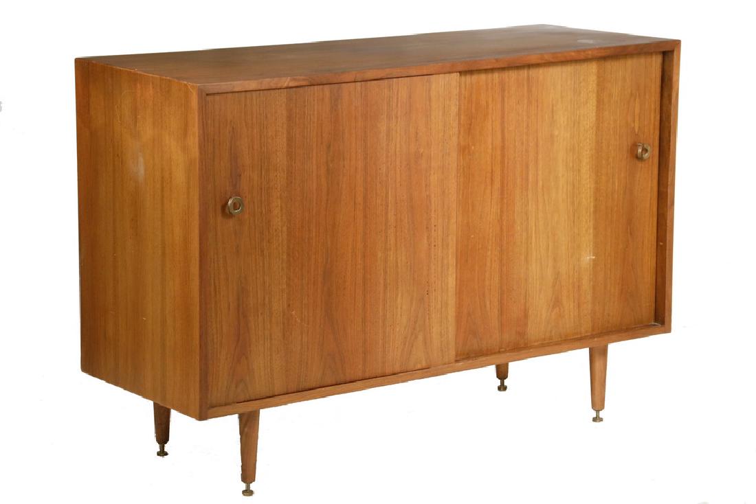 DANISH MODERN CREDENZA: Arne Vodder Mid Century Teak Cabinet with two sliding doors having brass ring knobs, concealing four orange painted oak drawers on right, shelf on left, raised on tapered round legs. 32 1/2" x 48" x 1