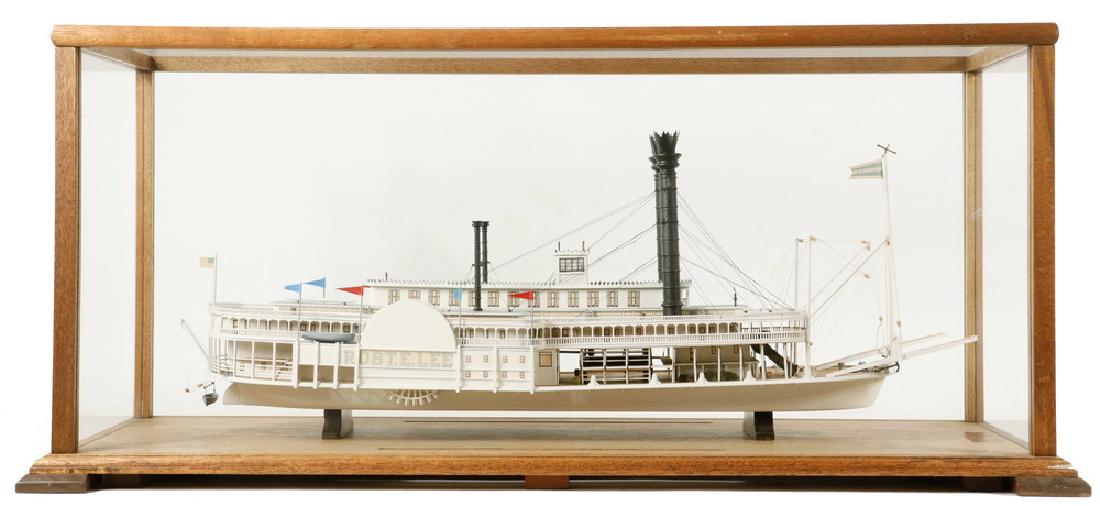 CASED BOAT MODEL: Steamboat 'Robert E. Lee' in mahogany and glass case. 13 1/2" x 30" x 11 1/2". Very good condition, one foot gone from case.
