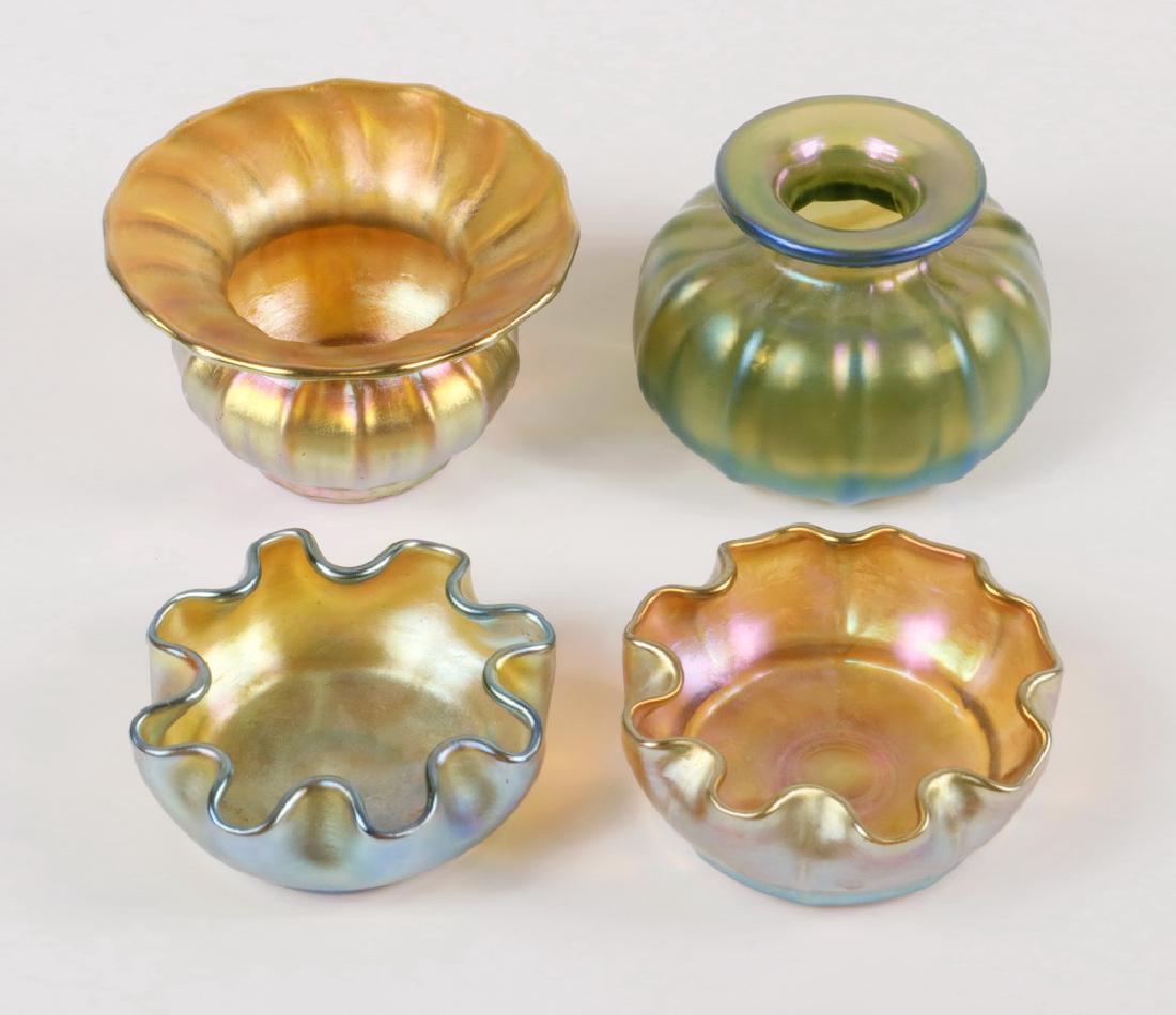 (4 PCS) IRIDESCENT & FAVRILE GLASS: Collection of (4) Pieces of Early 20th c. Iridescent Glass, including: (2) Louis Comfort Tiffany Favrile low bowls with scalloped rims, one gold and one green, both etched 'L.C.T.' on base, 1" high, 2