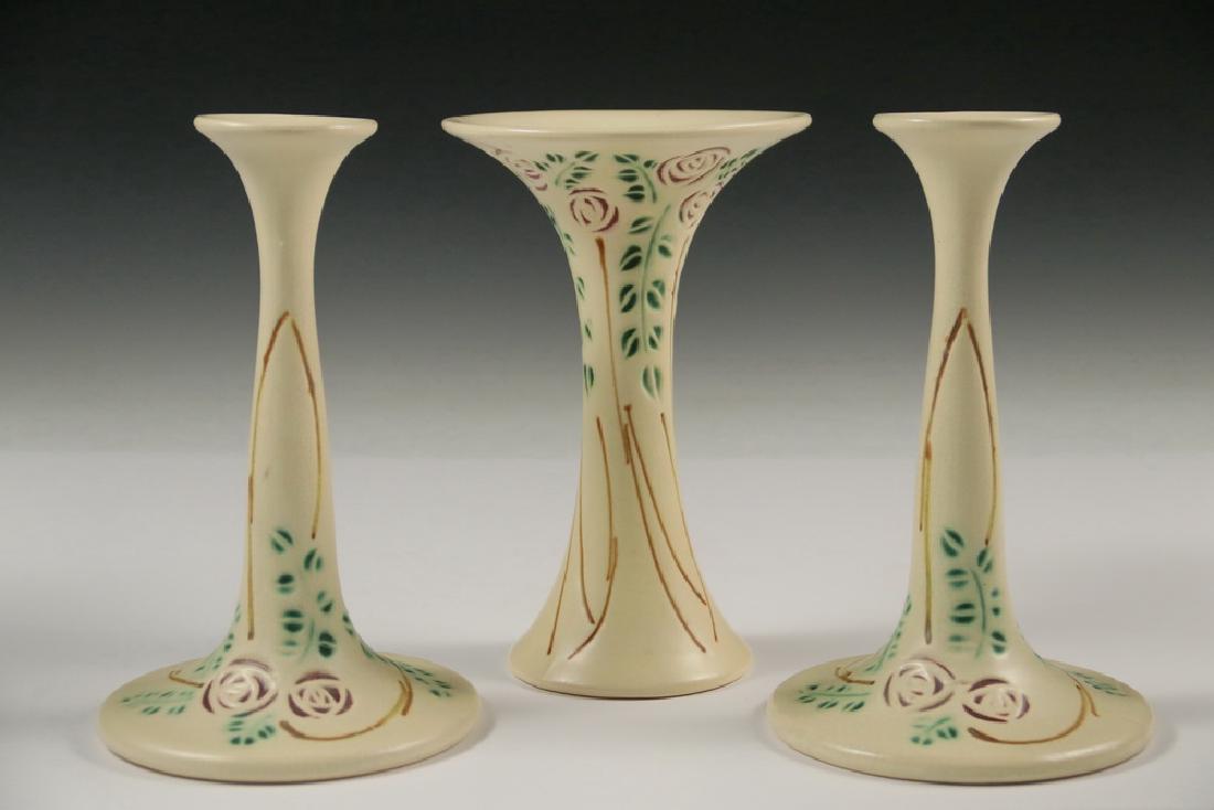 (3 PCS) ROSEVILLE ART POTTERY: (3 Piece) Group of Early 20th c. Roseville Pottery in the Rare Velmoss Scroll Pattern, including: Pair of candleholders, #1044, 8 1/4" high, 5" diam.; and a Flared rim vase, 8" high, 5 1/4" diam. All 