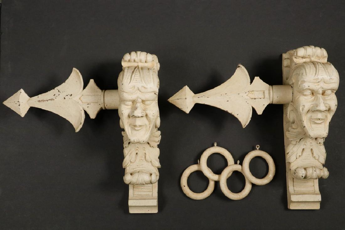 PAIR CARVED CURTAIN ROD HOLDERS & (13) RINGS: Pair of Carved and Painted Oak Figural Curtain Rod Holders, late Victorian era, wall mount, depicting a Green Man form face, with decorative end caps, PLUS (13) similarly colored curtain rings, 13" hi