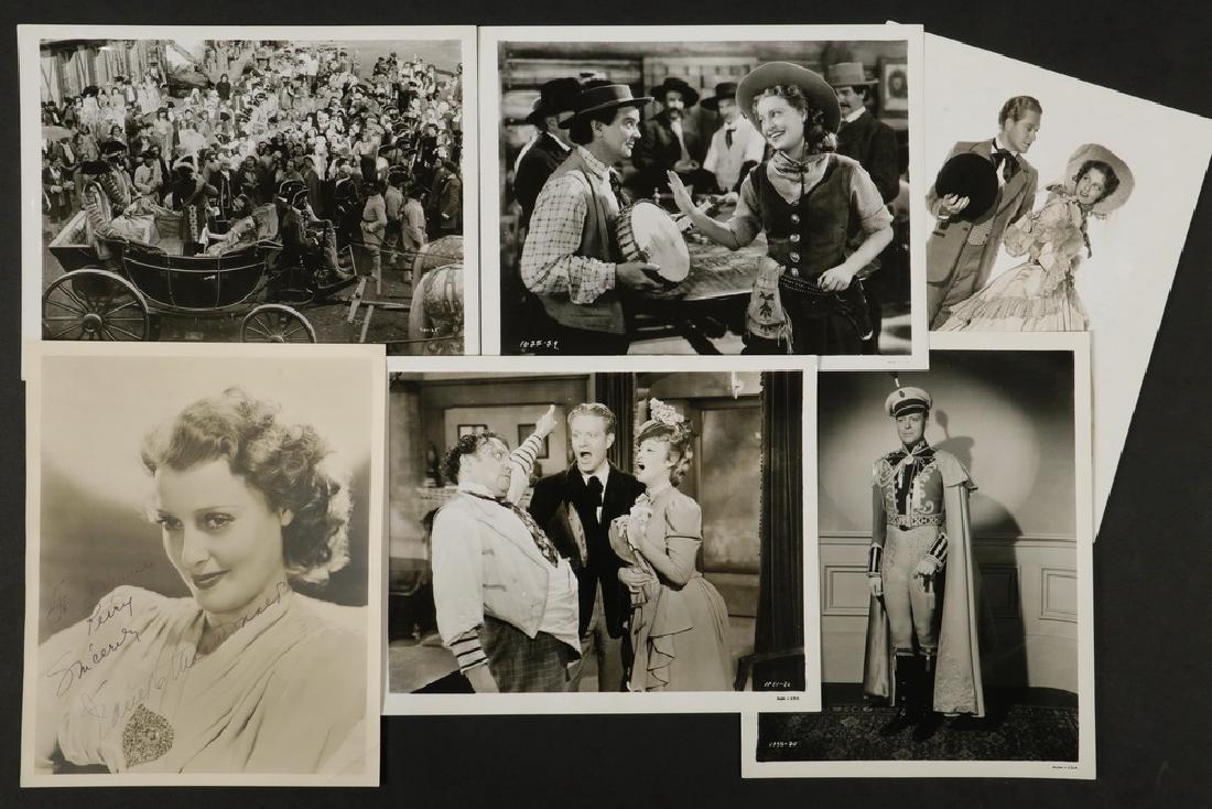 COLLECTION OF (50) B&W MOVIE PHOTOS: Original 1930s Studio 8x10 Glossy Photos of Film Stars Jeanette MacDonald (1903-1965), some with Nelson Eddy (1901-1967). One is actually a doubleweight satin with authentic autograph of Jeanette made