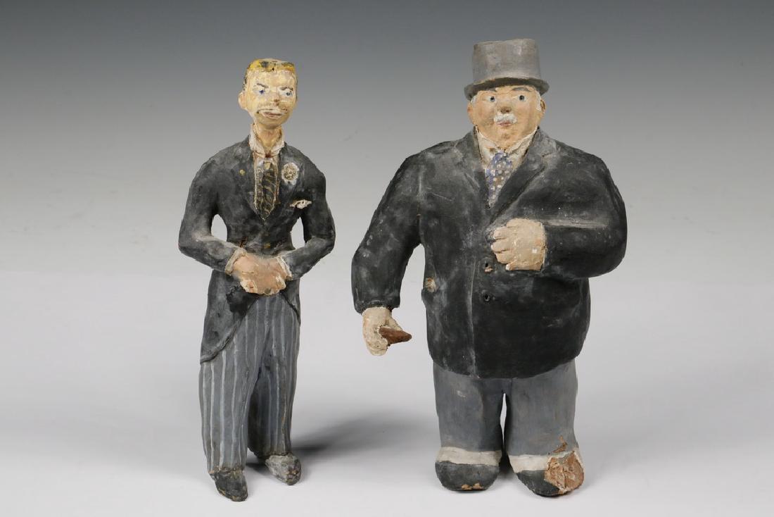 PAIR PAPER MACHE FIGURES: Pair of Paper Mache Figures, depicting formally attired men - one fat, one thin, possibly Laurel & Hardy, rotund figure signed on foot 'Zellie', 9" high. Chip to left foot of rotund figure, minor chip