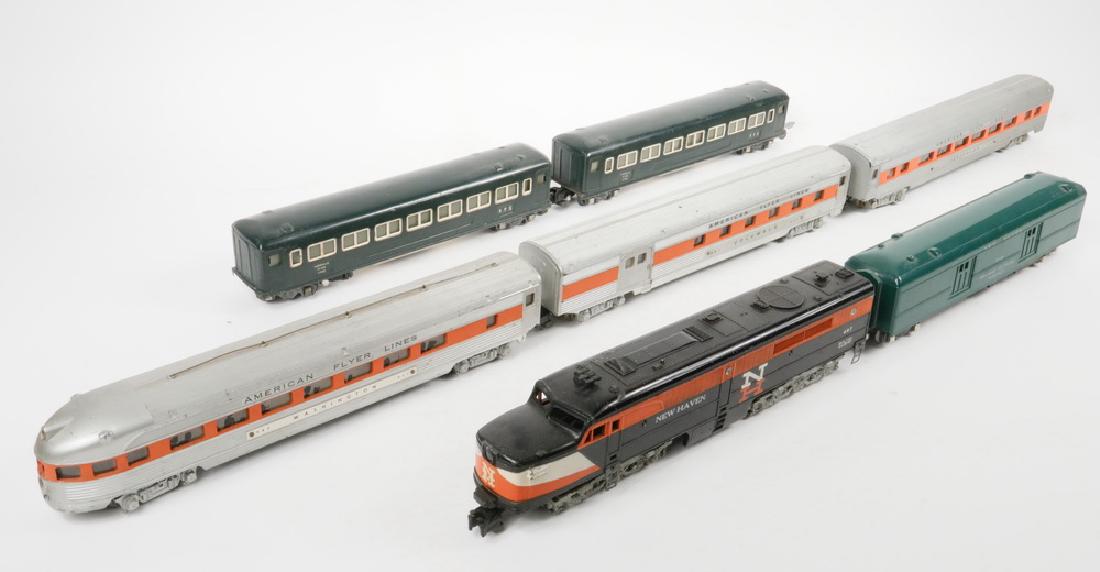 (7) VINTAGE MODEL TRAIN CARS: Group of (7) Vintage American Flyer Model Train Cars, mostly S gauge, including: New Haven 497 Diesel Engine, 3 1/8" high, 12" wide; Washington 963 streamline observation car, 2 3/4" high, 13" wide; C