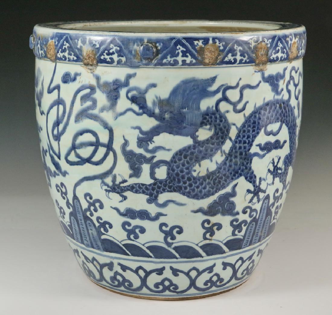 CHINESE BLUE & WHITE JARDINIERE: Large Chinese Blue & White Planter or Fish Bowl, two-part construction, with writhing dragon design around body, decorated with row of applied round lugs around top rim, unglazed base, unmarked, 16" h