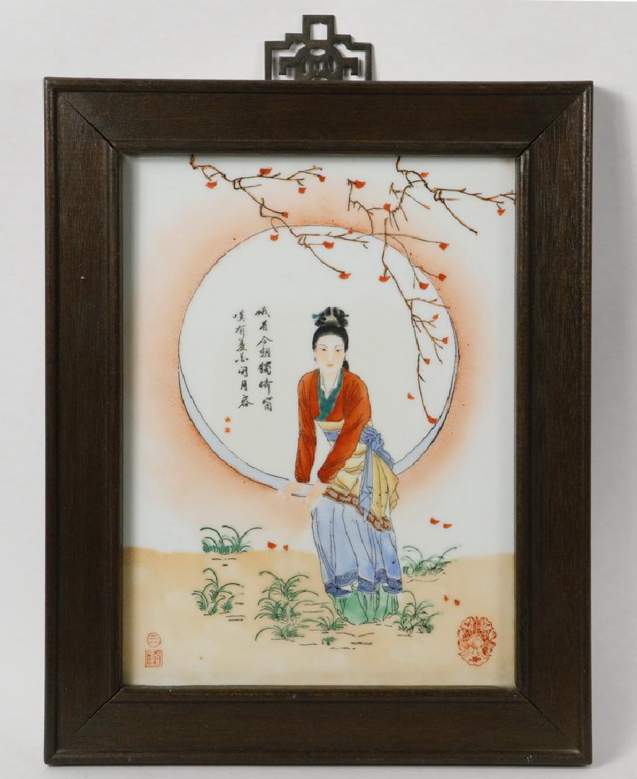 FRAMED RECTANGULAR CHINESE TILE: 20th c. Lovely Woman seated in a Garden Wall Moon WIndow, looking directly at the viewer, under a tree branch, with inscription, in wooden frame, 15" x 12". Good condition.