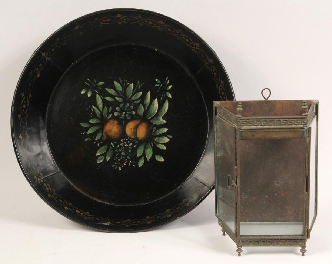 (2 PCS) COUNTRY METALWARE: Both 19th c., including: Toleware Tin Milk Pan with fruit stencils at bottom, gold geometric band at top of the interior, 3 1/2" x 14 1/2" diam, good condition; PLUS Pressed Brass Wall Hanging Candle