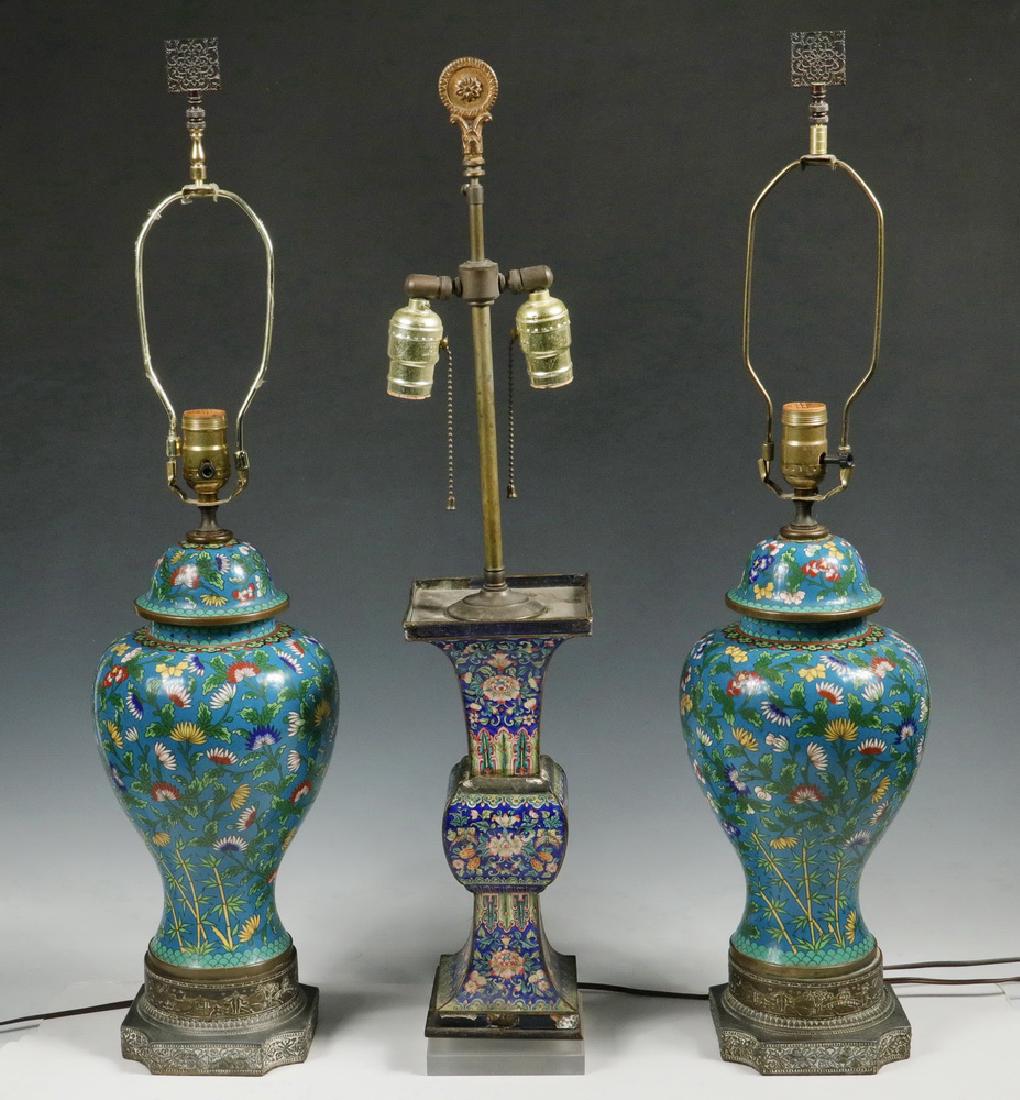 (3) CHINESE CLOISONNE TABLE LAMPS: Group of (3) Chinese Cloisonne Table Lamps, including: Pair of tall lamps with floral decoration on a turquoise blue background, on embossed metal bases, with harps and metal finials, 30" high, 6 3/4"