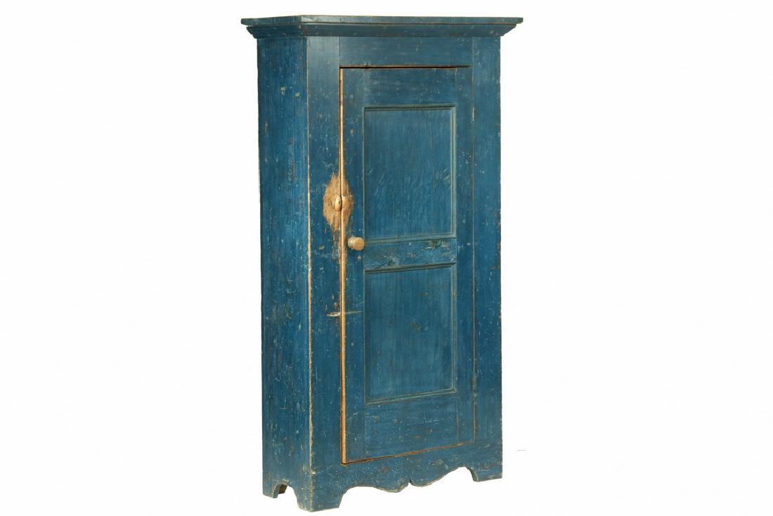 MAINE COUNTRY CUPBOARD: 19th c. One Door Pine Cupboard in the original dump cart blue paint, having a deep molded flat cornice, double panel door with wooden thumb latch and mushroom knob concealing four-shelf unpainted inte