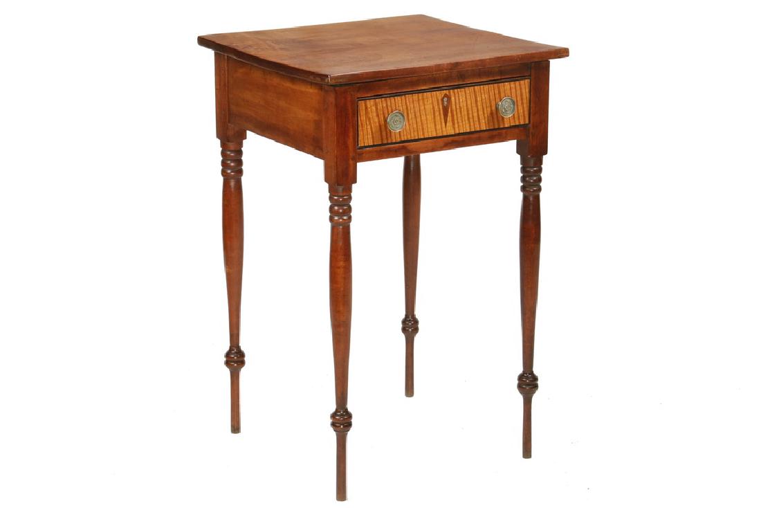 SINGLE DRAWER BIRCH STAND WITH DELICATE LEGS: 19th c. New England Sheraton Workstand, in walnut stained birch, having an overhanging single plank top, tiger maple drawer front with brass pulls and diamond inlaid escutcheon, raised on delicate rin