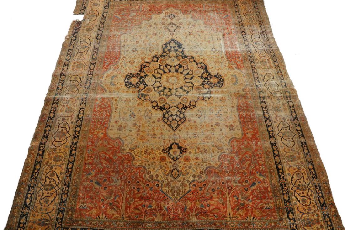 FEREGHAN-SAROUK CARPET - 8'-4" x 11 1/2': West Persia, late 19th c., large lobed midnight blue diamond medallion, with matching anchor pendants, with flowerheads and palmettes in blue-green, terra cotta, sage green and gold, set on a tan fiel