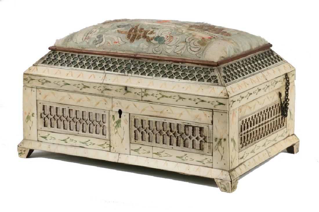 PRISONER-OF-WAR CARVED BONE SEWING BOX: Early 19th c. Prisoner-of-War Carved Bone Sewing Box, probably Napoleonic, with pin cushion top, intricate blind lattice panels, and scratch carved and stained decoration, newer velvet lining, 6" high