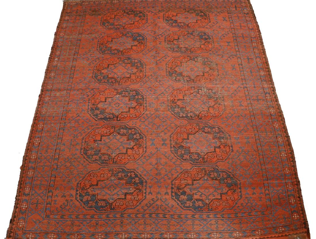 AFGAN TURKOMAN CARPET - 7' x 8'-6": Afganistan, late 19th c., two columns of six large guls in red, rust red, Persian blue and midnight blue, on a rust red field, rust red cruciform border. Very extensive pile wear.