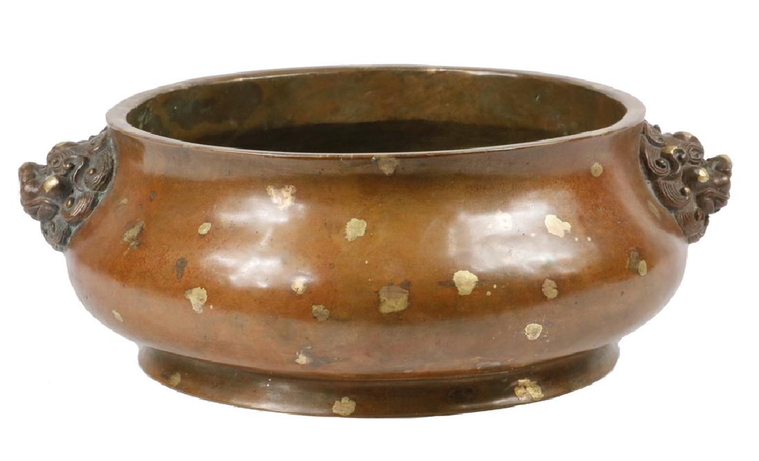 CHINESE BRONZE CENSER: Chinese Ming Dynasty Style Gold Splashed Bronze Squat Censer, with two qilin head lug handles, Xuande six-character mark on base, 3 1/2" high, 9 1/4" wide. Good condition.