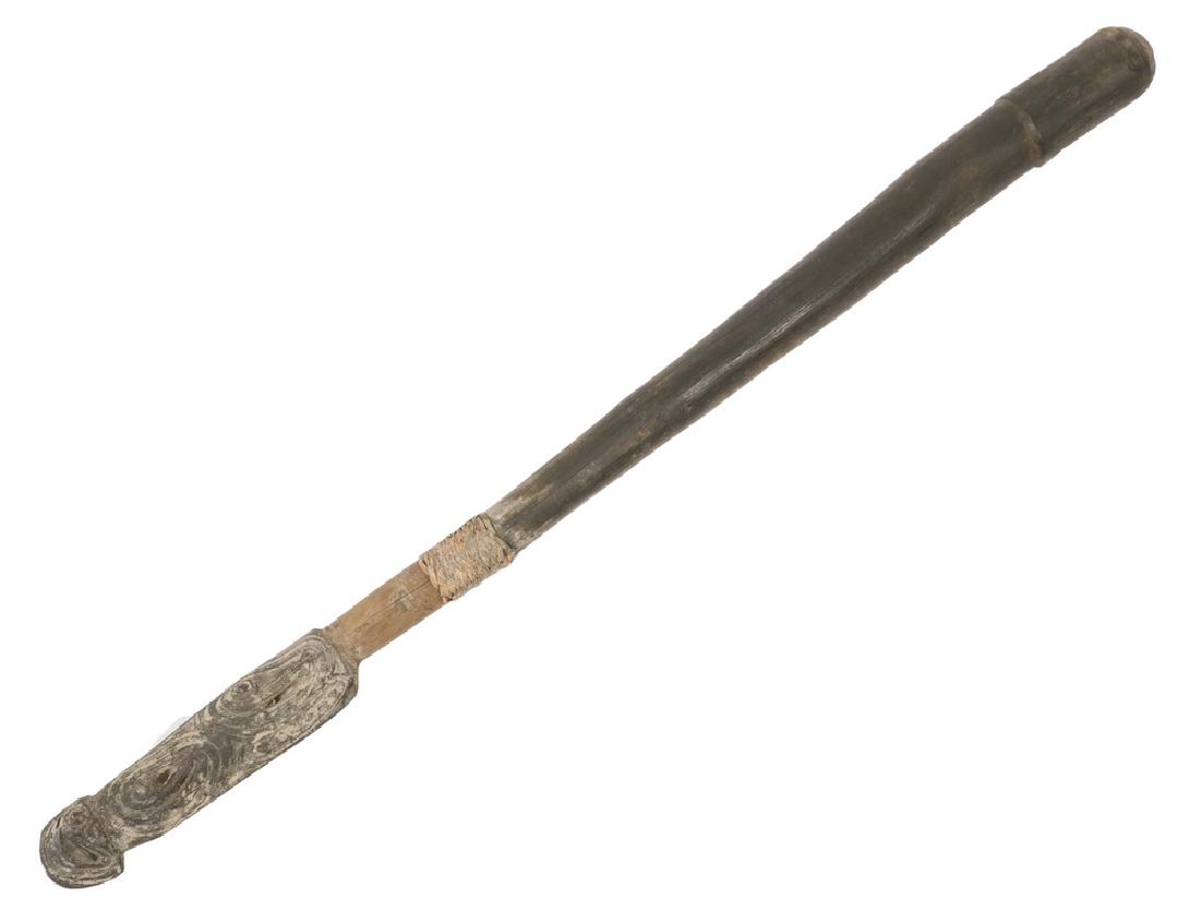 NEW GUINEA DRUM BEATER: 19th c. Hardwood Sacred Drum Beater (mi ras or ga hei), with carved and reticulated heel, remnant of fiber wrapping at grip, Upper Sepik region, Papua, New Guinea. 30 1/2" long. Shrinkage cracks. A ve