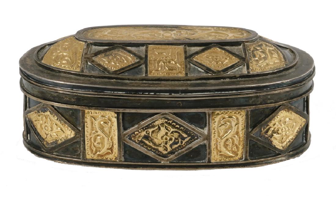 BETEL NUT BOX: 19th c. Silver and Gold Oval Betel Nut Box, probably Sumatra, hinged lid with repousse decorated 22K gold panels applied to the surface, three interior hinge-lidded compartments, 2 3/4" high, 5 7/8" x