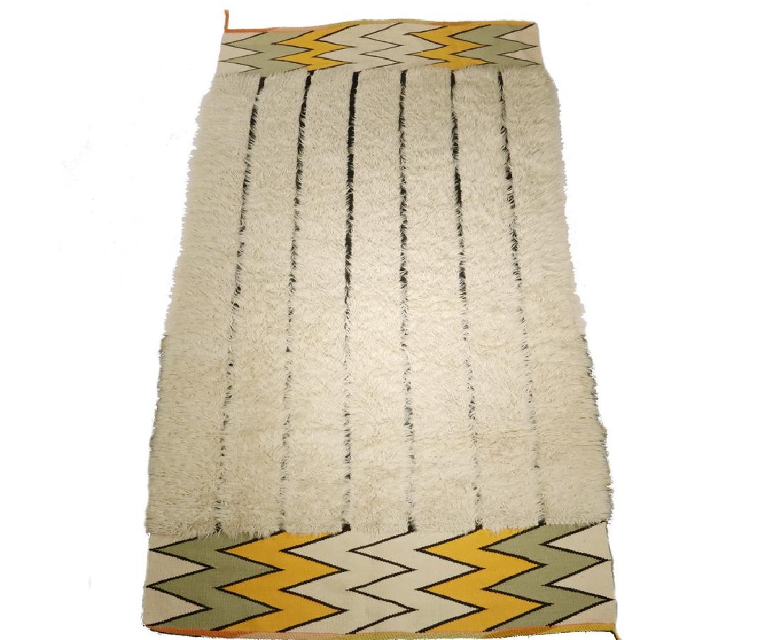 MID-CENTURY SCANDINAVIAN RUG - 44" x 80": Handmade Modernist Swedish "Rya" Rug, in the manner of Lis Ahlmann, having a center with parallel black stripes dividing rows of white 'alpaca fur', resolving to ends in green, buff and yellow zigzag 