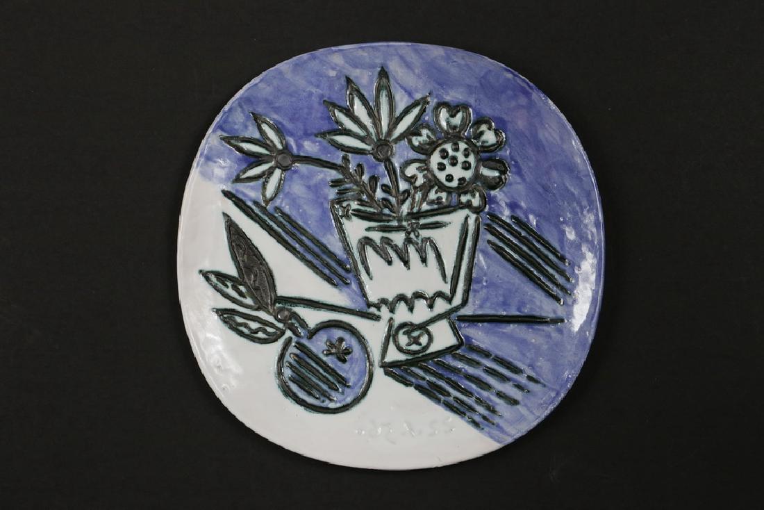 PABLO PICASSO (SPAIN/FRANCE, 1881-1973): "Bouquet a la Pomme", glazed earthenware plate with raised decoration, dated 22.1.56, stamped "Madoura Plein Feu/ Empriente Originale de Picasso". 9 7/8" diam. Fine condition. Literature: Listed and i