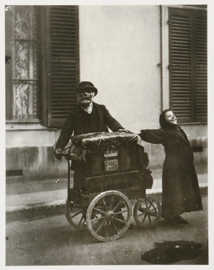 EUGENE ATGET (FRANCE, 1857-1927): "Organ Grinder and Girl (Joueur d'Orgue), 1899", gelatin silver print, from the original glass negative, printed by his protege Berenice Abbott (who inherited them directly), circa 1980, back stamped