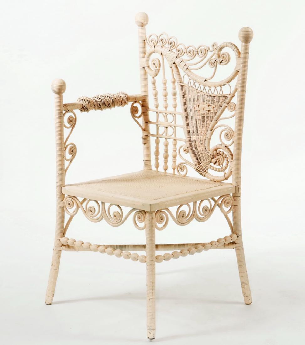 VICTORIAN PHOTOGRAPHER'S WICKER CHAIR, MAINE PROVENANCE: Ornate Corner Chair in vintage pink paint, purportedly from the old Samoset Hotel of Rockland, Maine. 16" seat, 30" arm, 37 1/2" back, 18" x 19", very good condition.