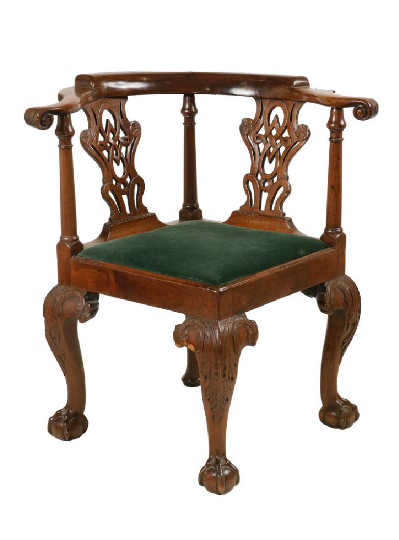 18TH C. CHIPPENDALE CORNER CHAIR: Well Carved Georgian Corner Chair in mahogany, with pillow block back, scrolled arms, pierced ribbonwork splats, ring and urn turned spindles, green velvet slip seat, and nicely shaped cabriole legs e