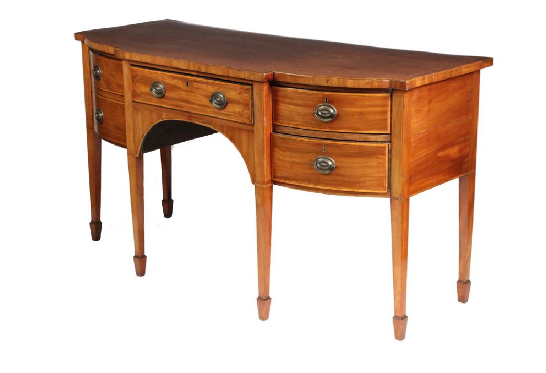 HEPPLEWHITE SIDEBOARD: Mahogany with boxwood, ebony and tiger maple banding, overhanging top, shallow center drawer above simple arched brackets, two bow front drawers on right, faux drawerfront cabinet on left, raised on t