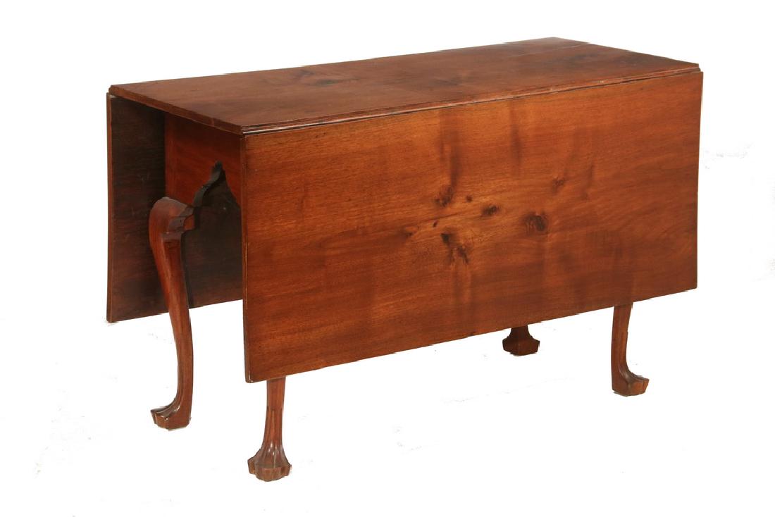 QUEEN ANNE DROP LEAF DINING TABLE: Solid Walnut Gate Leg Table, narrow with deep square cornered leaves, very deep skirt with shaped arches at ends, raised on slender cabriole legs ending in trifid feet. 28" x 45 3/4" x 19", 18 1/2" le