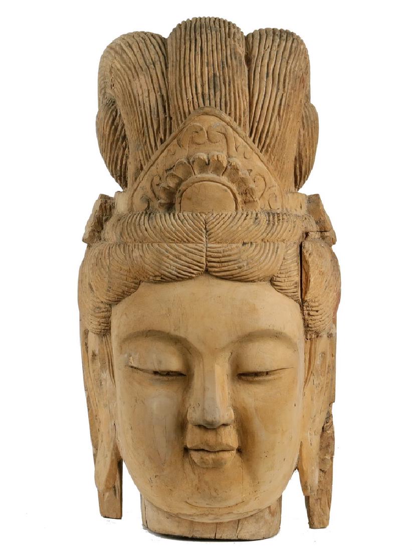 CHINESE CARVED DIETY HEAD: Wooden Head, Xian, China, circa 1870-1875, the goddess Guanyin, a Chinese deity originally known as Avalokitesvara in Buddhist tradition. 15 3/4" tall. Shrinkage cracks.