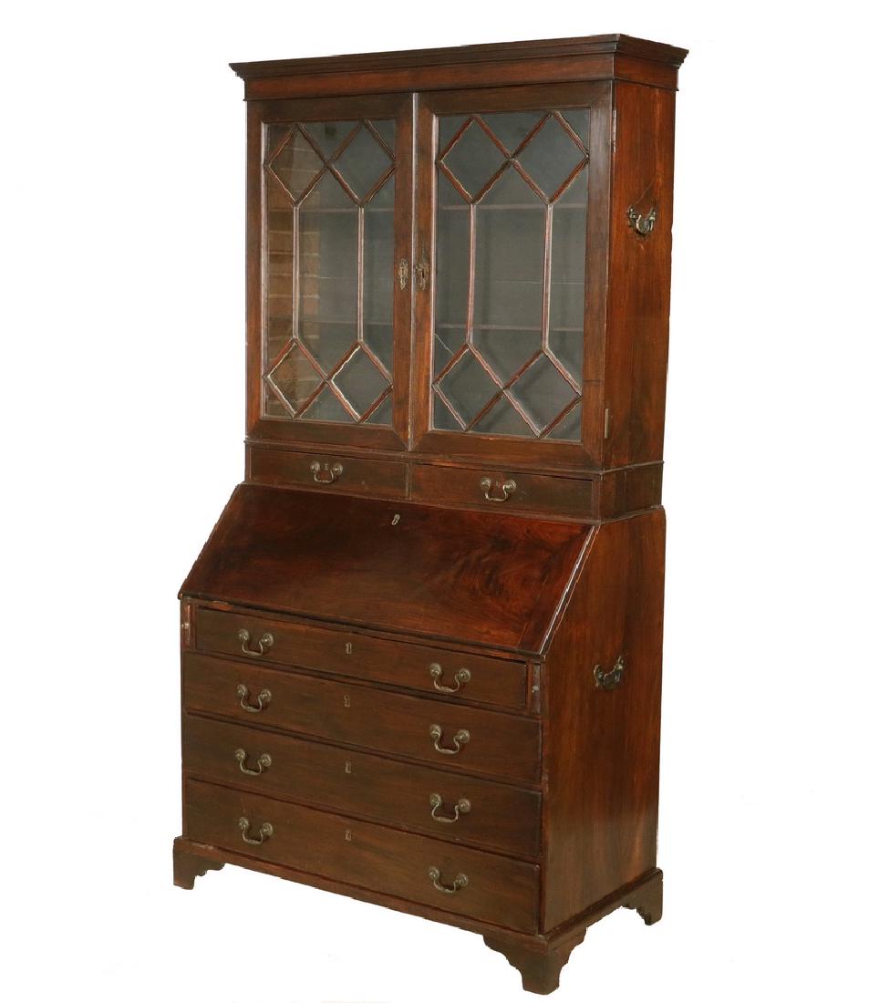 18TH C. CHINA TRADE TWO-PART SECRETARY: Export Bookcase /Slant Front Desk in Padauk wood, in Chippendale style, circa 1780, having a molded flat cornice, two diamond mullioned doors retaining old glass (one cracked pane), two adjustable she