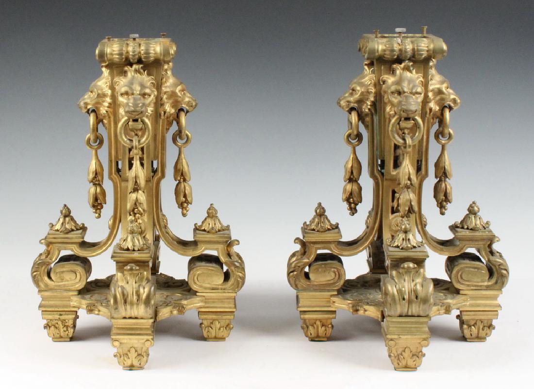 PAIR OF FRENCH FIRE GILT BRONZE LOW PEDESTALS: Late 19th c. Renaissance Revival Pedestals, having lion head decorated posts resting on four acanthus leaf scrolled legs on conforming platform, with bellflower pendants, the hollowcast top has center